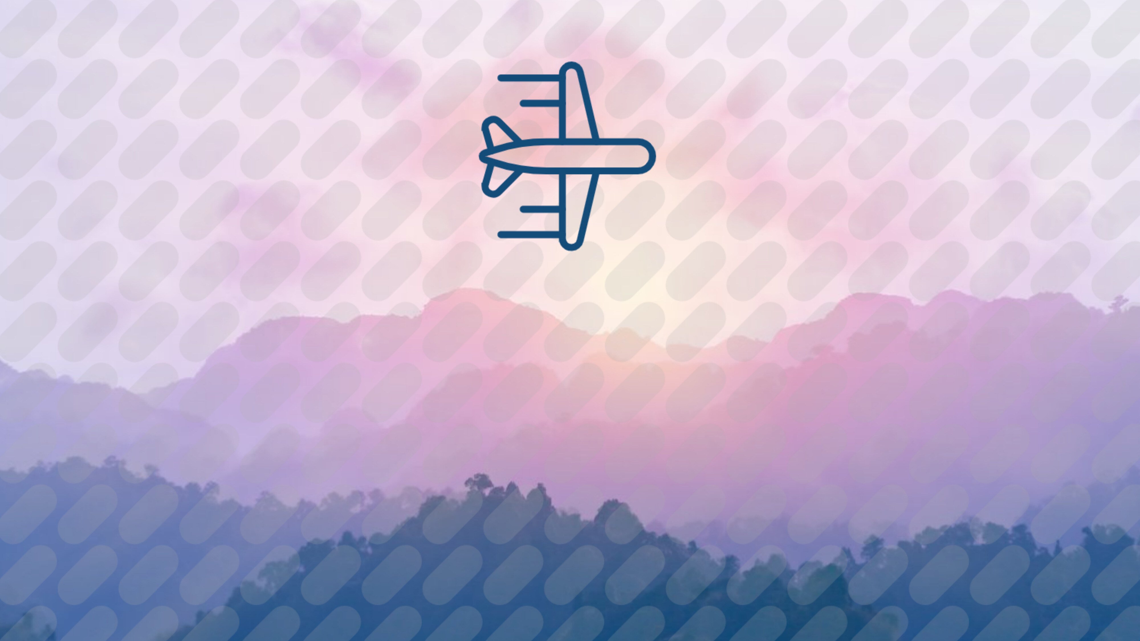 Airplane in sky above mountains